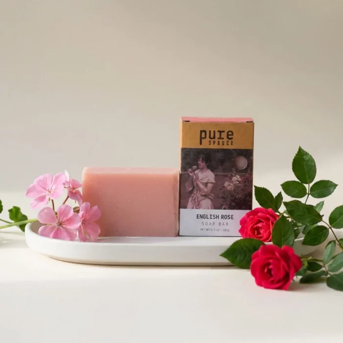 English rose soap bar beside box by pure spruce